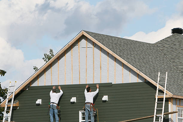 Professional Siding Installation technician working in Utica, OH